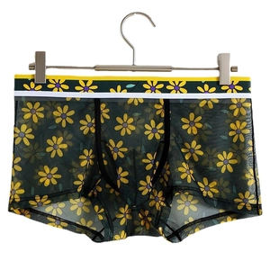 Men's ice silk boxer briefs with green daisy print and yellow elastic waistband