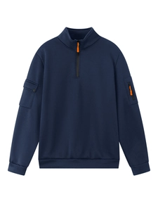 Detail of navy quarter-zip sweatshirt with orange zipper pull and sleeve pocket