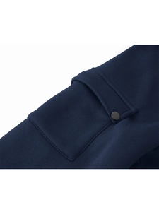 Detailed close-up of navy blue zip hoodie sleeve featuring a utility pocket and matte button