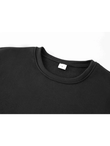 Detailed close-up of a black sweatshirt neckline showing the M size label and stitching