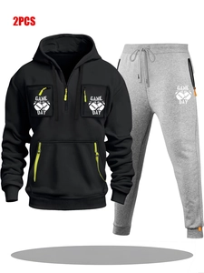 Detail of men's black half-zip hoodie and grey joggers with Game Day prints