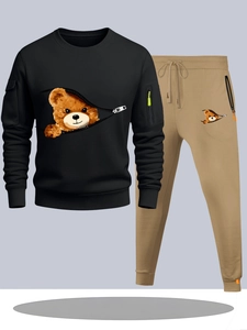 Detail of the hoodie and joggers set featuring functional zippers and bear prints