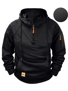 Detail of men's black hoodie with orange zipper pulls and tactical sleeve pockets
