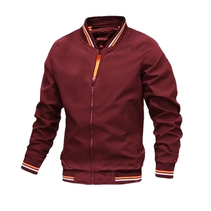 Detailed shot of the burgundy bomber jacket ribbed cuffs with orange and white stripes