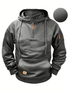 Detail of charcoal grey hooded sweatshirt with grid texture fabric and orange zipper