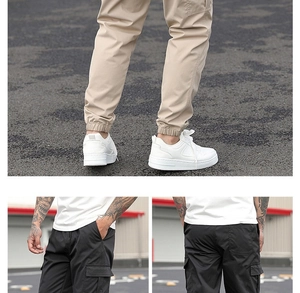 Dettaglio dei pantaloni cargo multitasche con coulisse in vita e polsini elastici in cachi