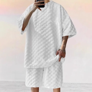 Detailed macro view of white waffle textured fabric on loose fit men's casual two-piece set