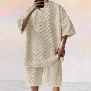 Detail of cream summer set featuring 3D textured grid fabric and relaxed silhouette