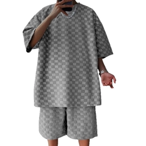 Men's casual grey checkerboard two-piece outfit with loose t-shirt and shorts