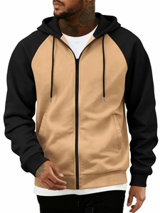Close-up of color-block zip hoodie with contrast raglan sleeves and ribbed hem details