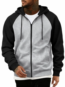 Detail of color-block hoodie with raglan sleeves, drawstring hood, and full front zipper