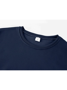 Close-up of navy blue crew neck sweatshirt with ribbed collar and inner size label detail