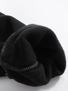 Close-up of black thermal fleece lining and high-density stitching for men's hoodies