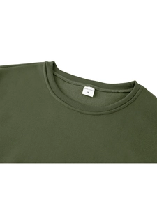 Detailed close-up of dark green crewneck sweatshirt rib collar with size M label