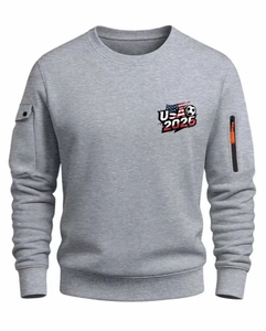 Detail of the grey sweatshirt showing the vertical zipper pocket and orange pull on the sleeve