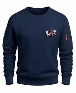 Detail of navy crewneck sweatshirt showing sleeve zipper pocket and USA 2026 print