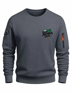 Detail of grey crewneck sweatshirt with Saudi Arabia 2026 print and utility sleeve pocket