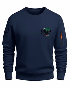 Detail view of navy blue sweatshirt showing zip utility pocket and ribbed cuff texture
