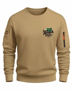 Detail of khaki men's sweatshirt featuring sleeve zipper and 2026 printed design