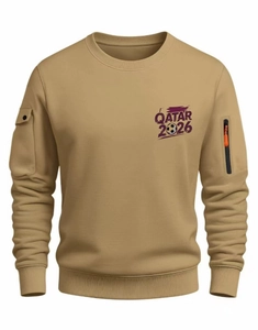 Detail view of khaki sweatshirt with QATAR 2026 print and orange zipper sleeve pocket
