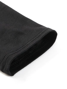 Detail of double-needle stitching on black long-sleeve cuff with premium knit texture