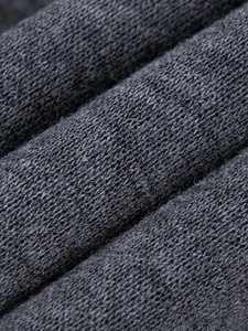 Close-up macro view of the dark grey knitted fabric texture showing soft warm fleece