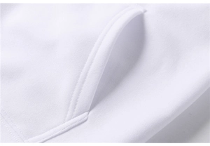 Detailed macro view of reinforced double-stitched kangaroo pocket on white cotton hoodie