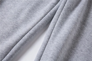 Detailed macro view of heather grey knit fabric texture on this casual hoodie sweatshirt