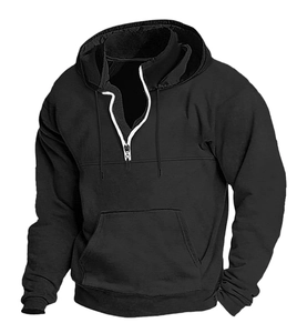 Detail of black men's hoodie featuring half-zipper with white trim and drawstring hood