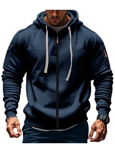 Detail of dark blue men hoodie with orange zipper accents and textured sleeve design