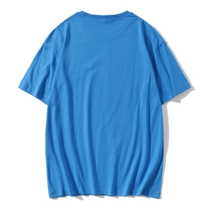 Back view of a plain bright blue cotton crewneck T-shirt in a loose and casual fit
