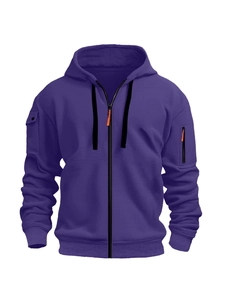 Detail of deep purple hoodie featuring multi-pocket design and orange zipper accents