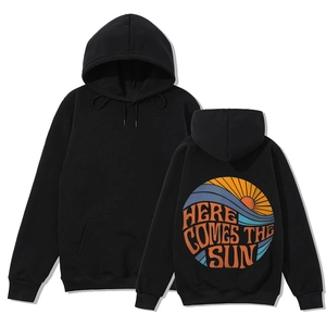 Detail view of black hoodie back print featuring sun and waves with Here Comes The Sun text