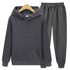 Detail view of dark grey fleece hoodie and joggers set with ribbed cuffs and drawstrings