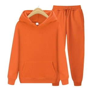 Detail of bright orange fleece tracksuit showing drawstring waistband and kangaroo pocket