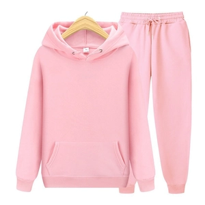 Detail view of pink fleece hoodie set showing the drawstring hood and ribbed cuffs
