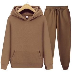 Close-up of brown hooded tracksuit featuring ribbed cuffs and size M neck label