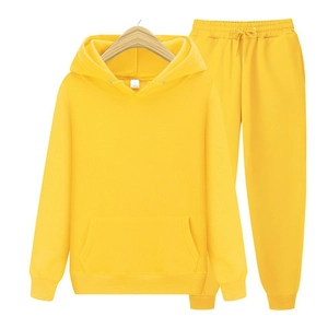 Detail of a bright yellow fleece hooded sweatshirt with drawstring and front kangaroo pocket