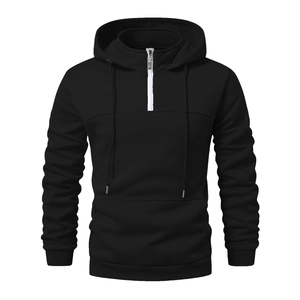 Detail of men's black half-zip hoodie showing the 1/4 zip collar and kangaroo pocket