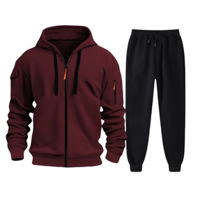 Detail view of burgundy zip-up hoodie with orange accents and matching black joggers set
