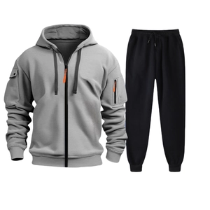 Close-up of gray hooded tracksuit jacket with orange zipper and black jogger pants