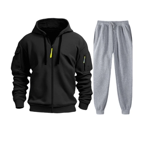 Detail of men's tracksuit set featuring a black zip hoodie with tactical arm pockets