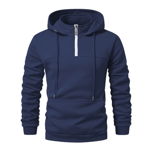 Detail view of a navy blue men's half-zip hoodie with ribbed cuffs and kangaroo pocket