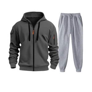 Detail of grey men's hoodie with orange zipper head and functional sleeve pocket