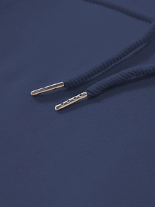 Detail of drawstring with gold metal aglets on high-quality dark blue hoodie fabric