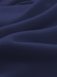Detailed view of navy blue soft fleece fabric texture on a premium men's hoodie