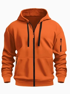 Detail view of orange men's zip-up hoodie featuring a black sleeve pocket and drawstring