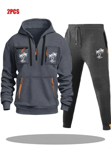 Vue détaillée de l'ensemble sweat à capuche gris avec zips oranges et imprimé palmier