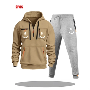 Men's khaki half-zip hoodie and grey jogger set with orange zippers and smile print