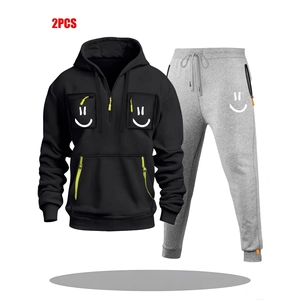 Men's two-piece hoodie set with zipper pockets, smile patterns, and neon green accents